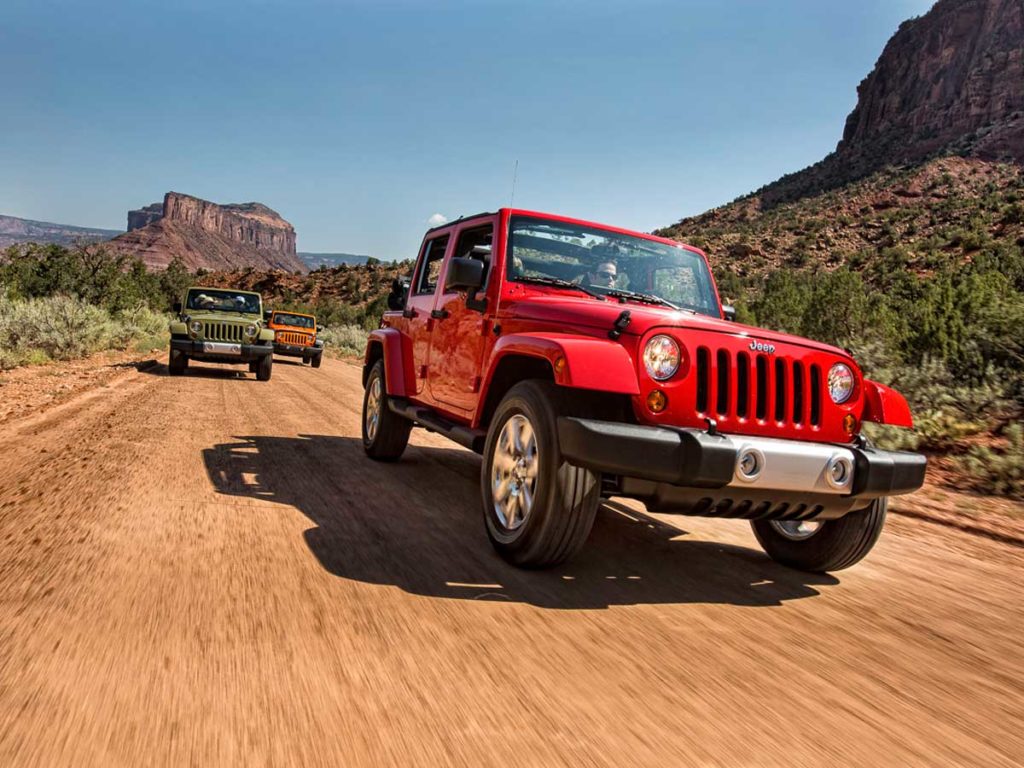 Jeep racing down road near Gateway Canyons Resort