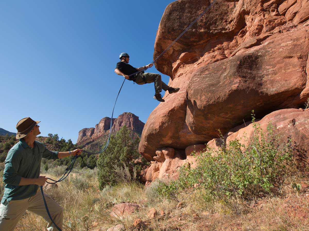 Man rock climbing near Gateway Canyons Resort