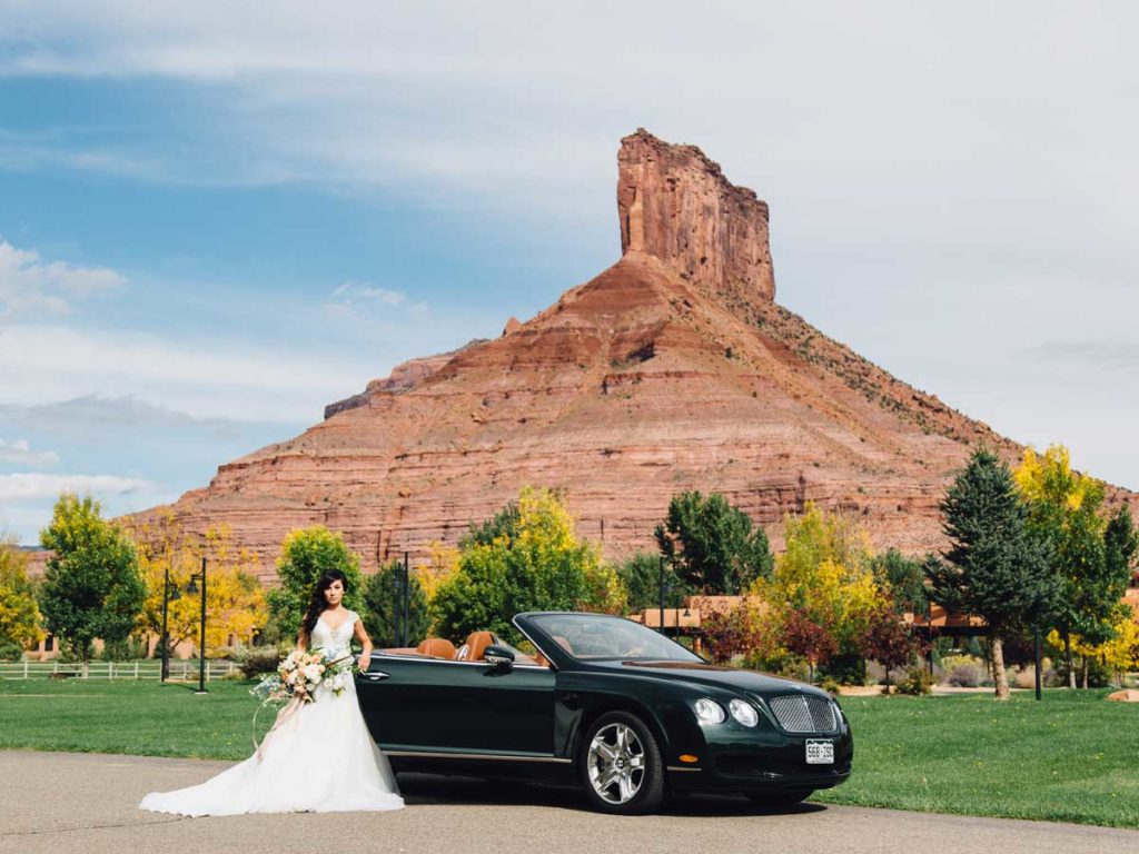 bride with car at Gateway Canyons Resort Wedding