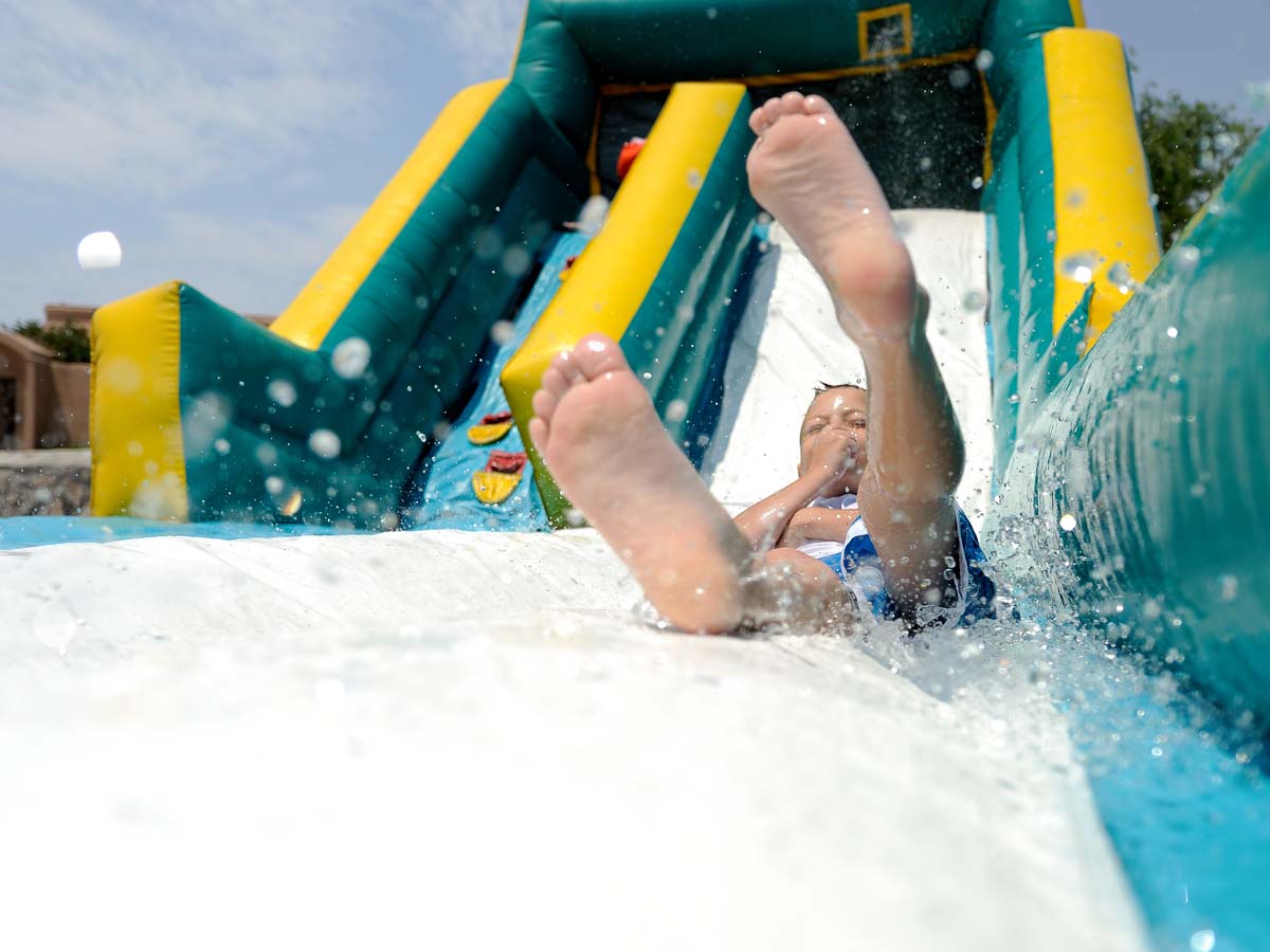 Kid Going Down A water Slide.